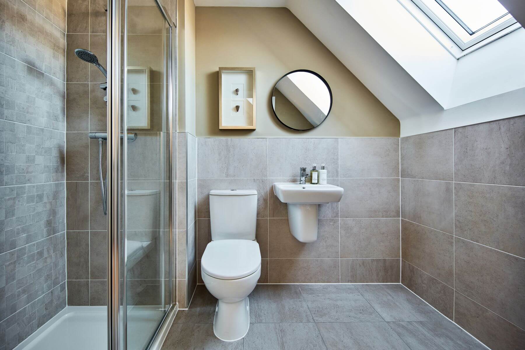 The en-suite benefits from a large double shower