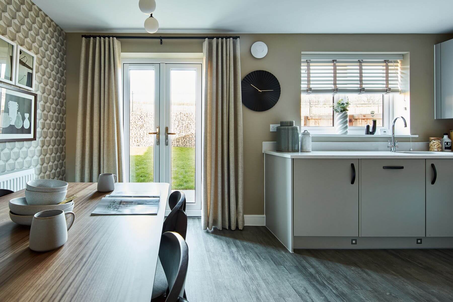 Double doors lead out from the dining area to the garden