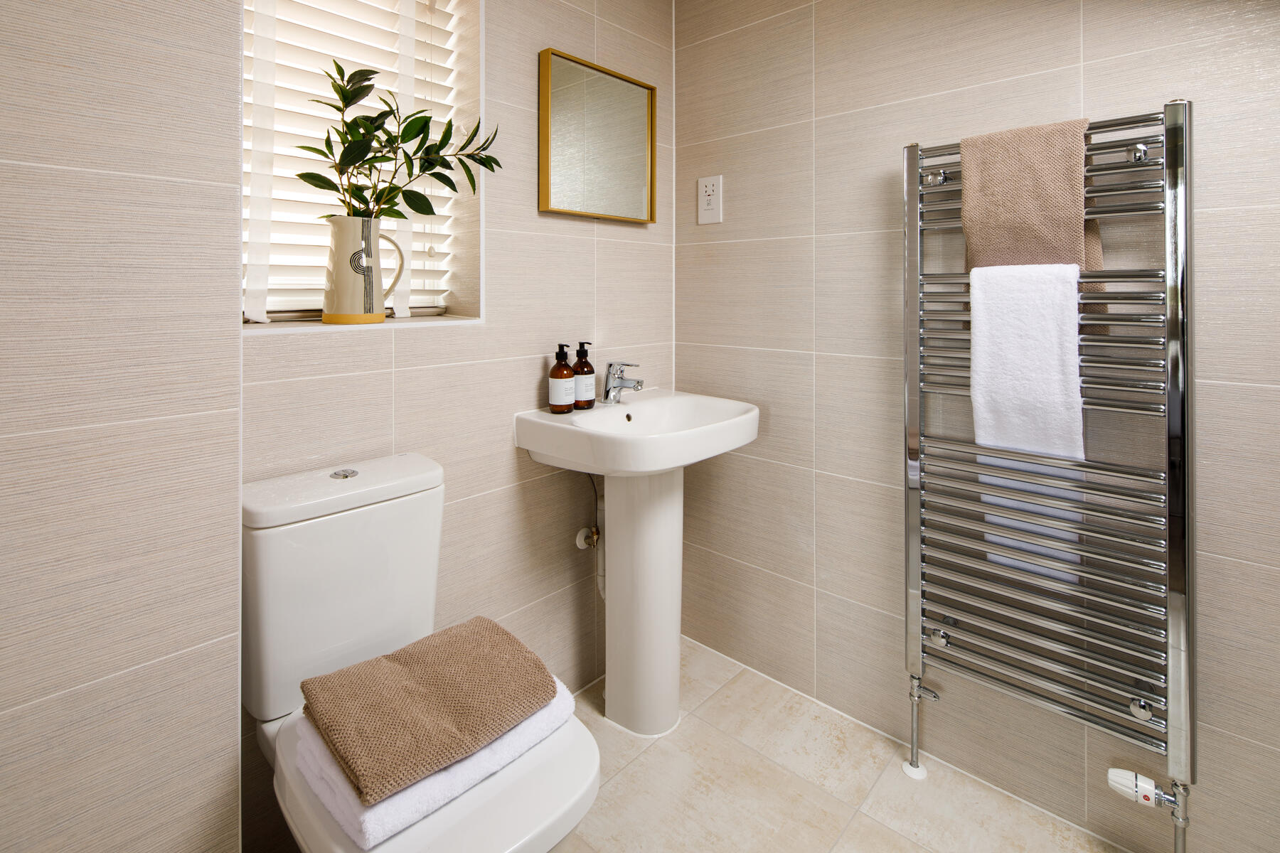The ensuite bathroom features a double shower enclosure 