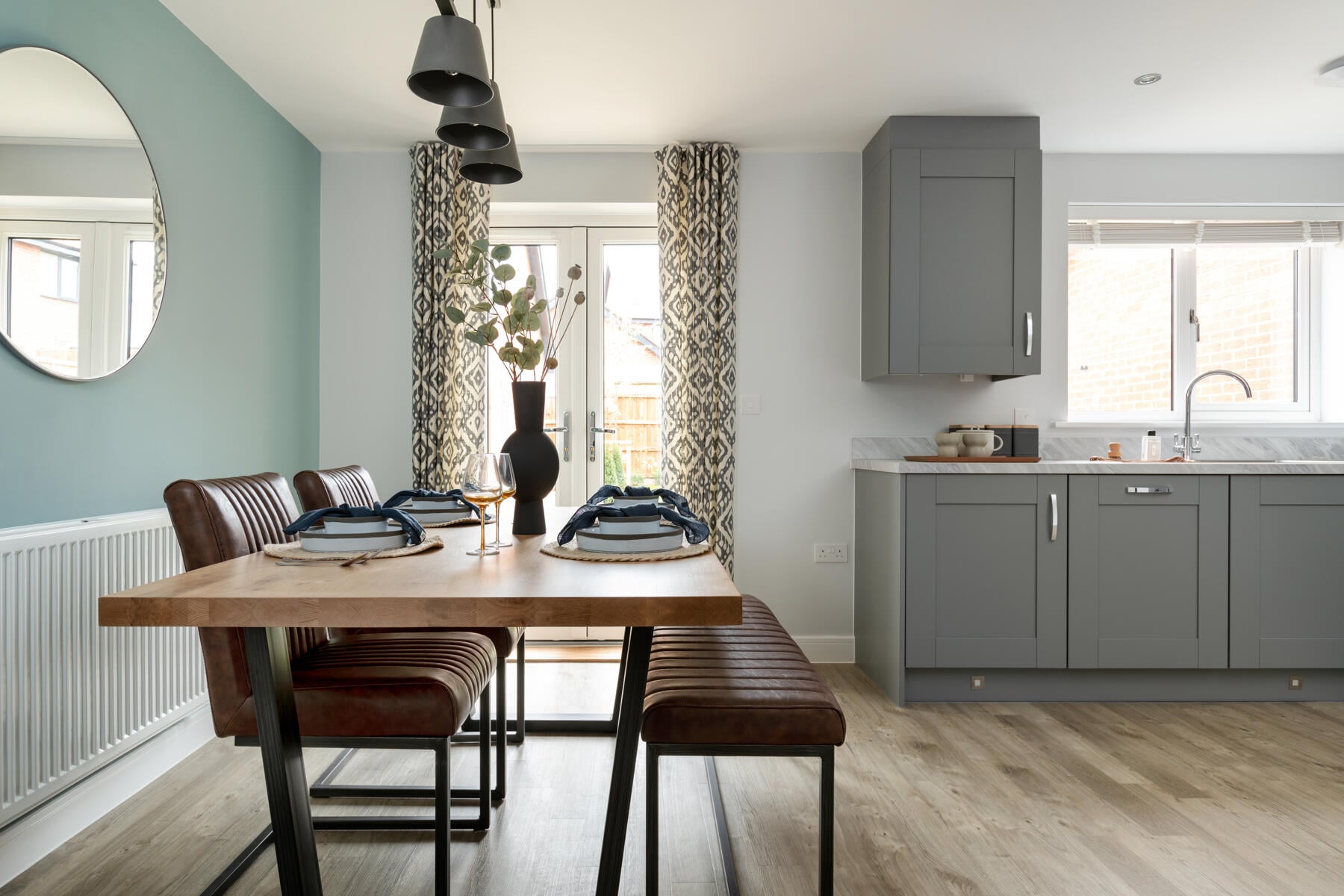 Double doors lead out to the garden from the dining area