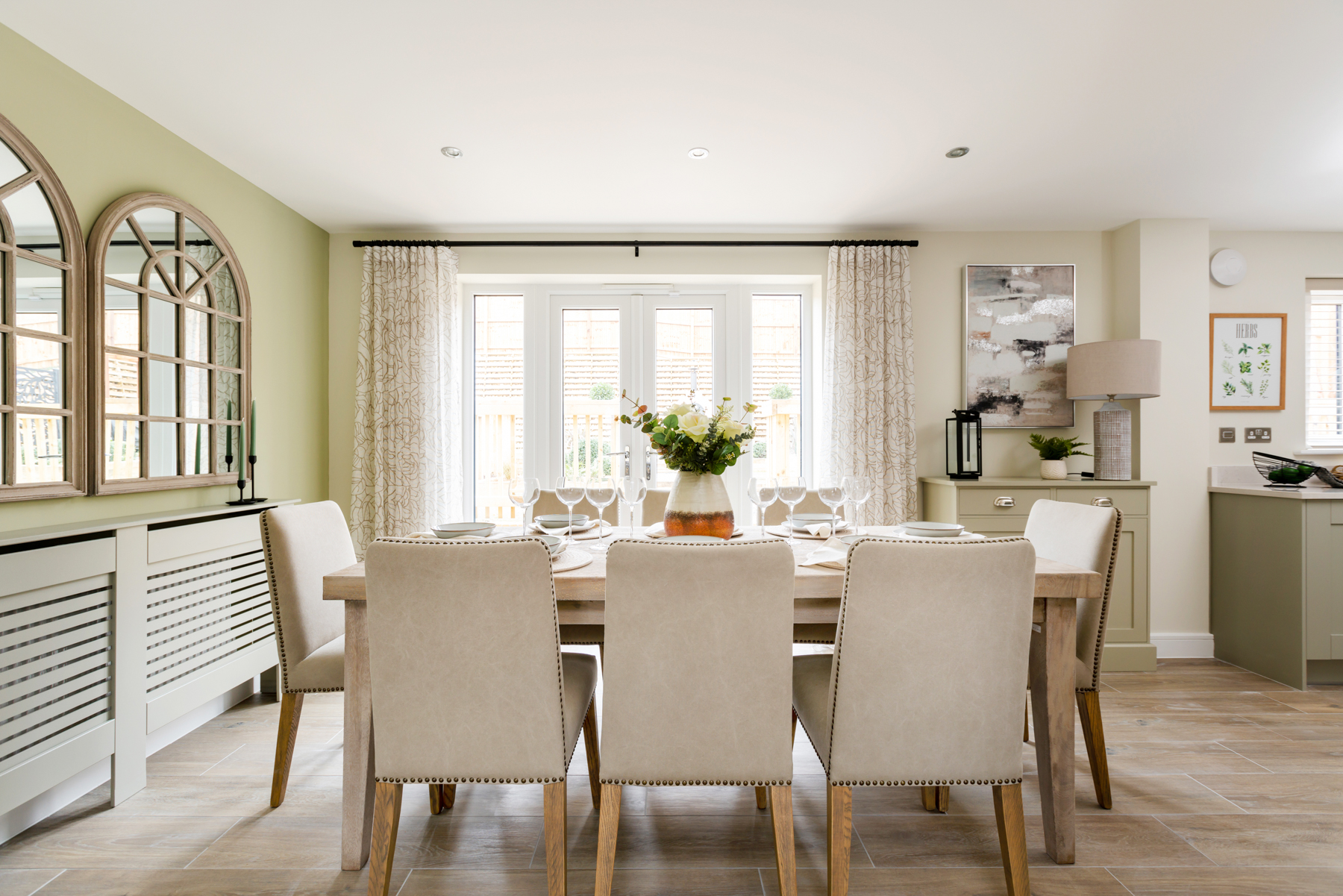 Double doors lead out from the dining area to the garden