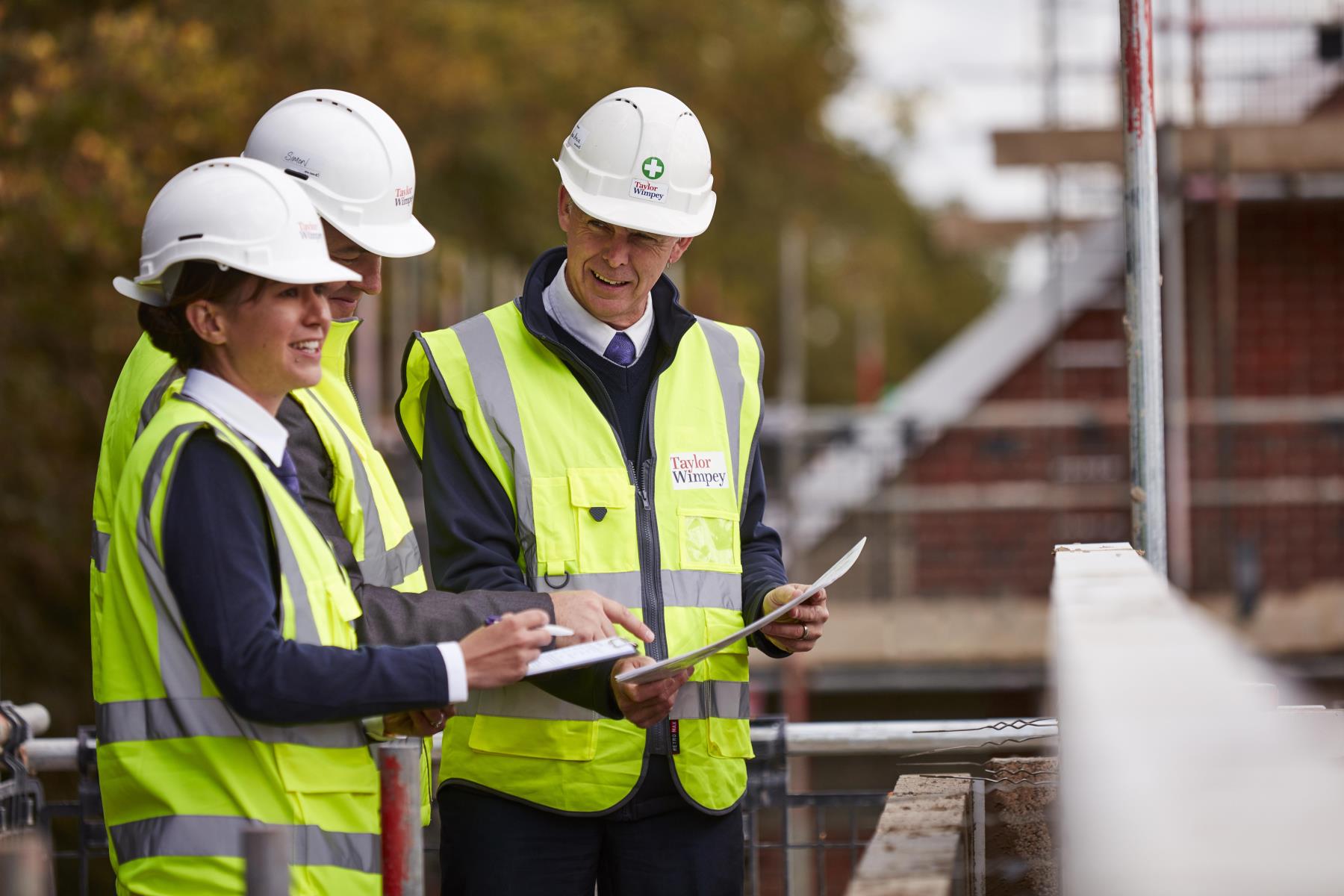 Site managers with clipboard