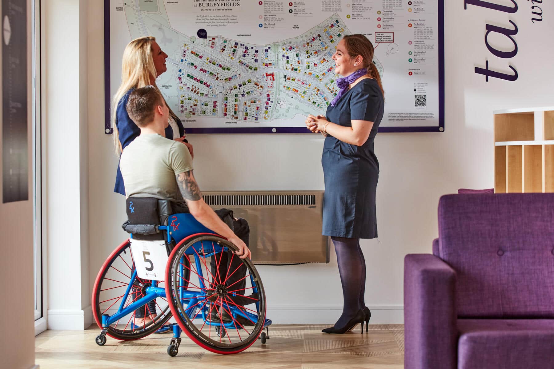 Taylor Wimpey staff with customers