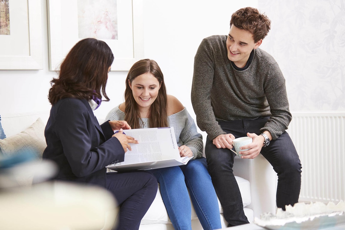 Sales Executive discussion with young couple