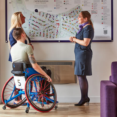 Customers and sales executive in sales office