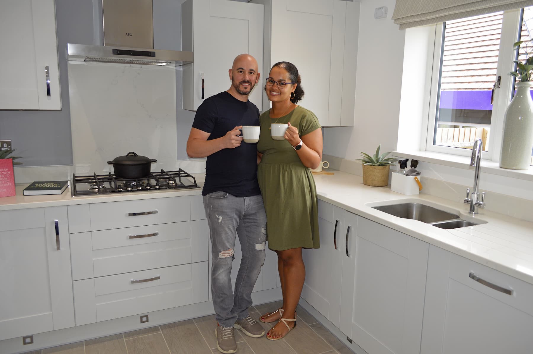 Couple standing in new home
