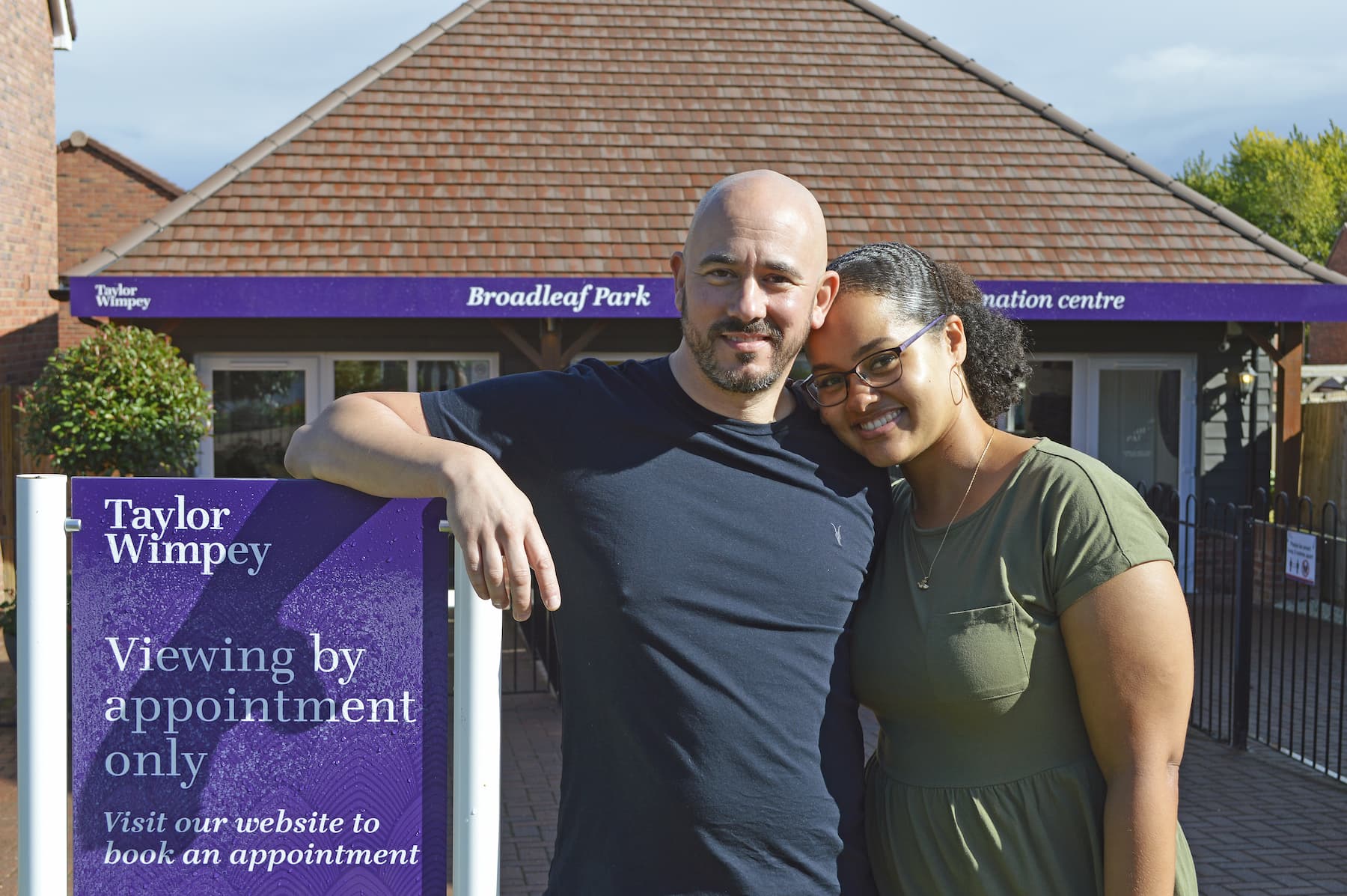 Couple stood outside Taylor Wimpey development