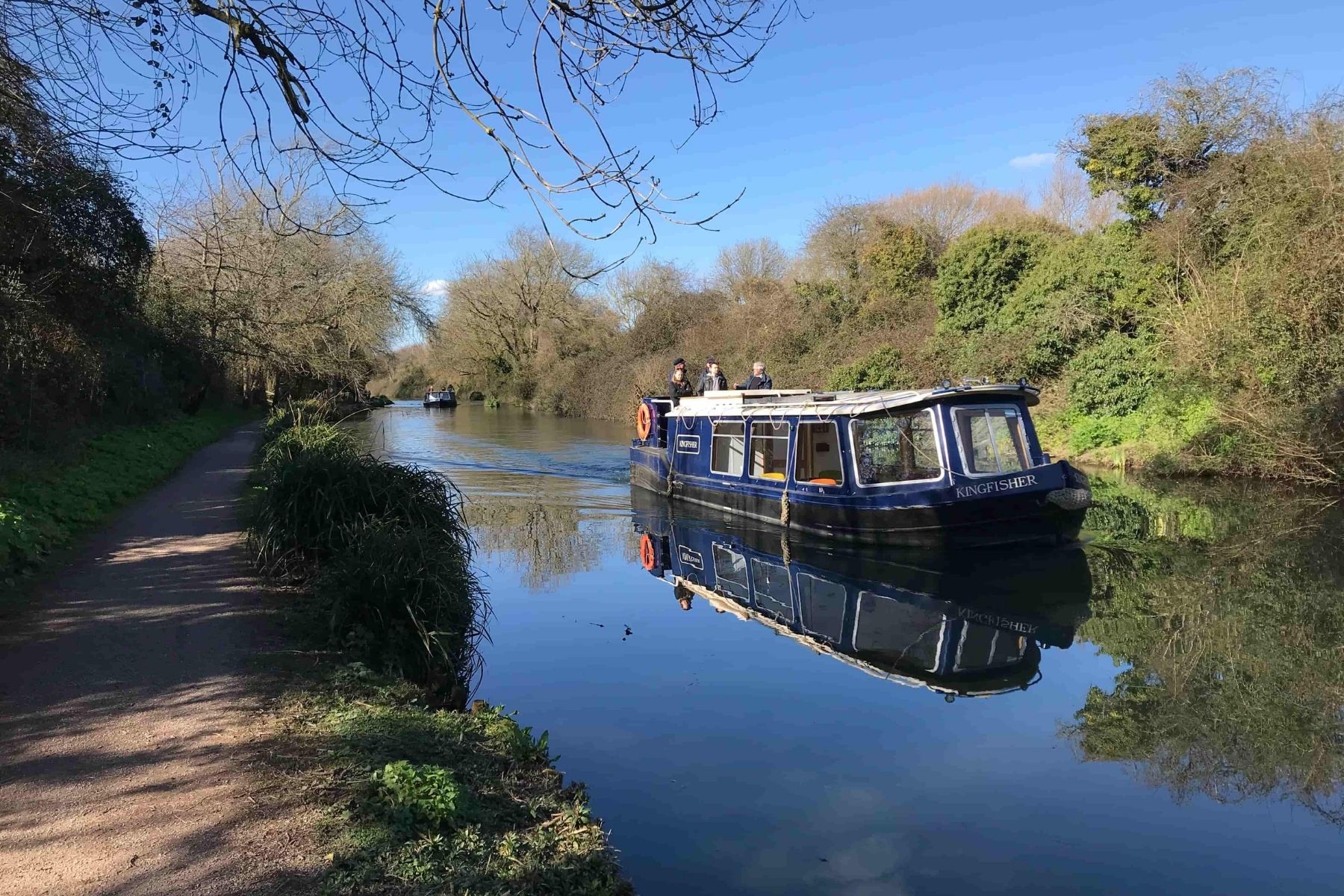 Canal with boat and trees