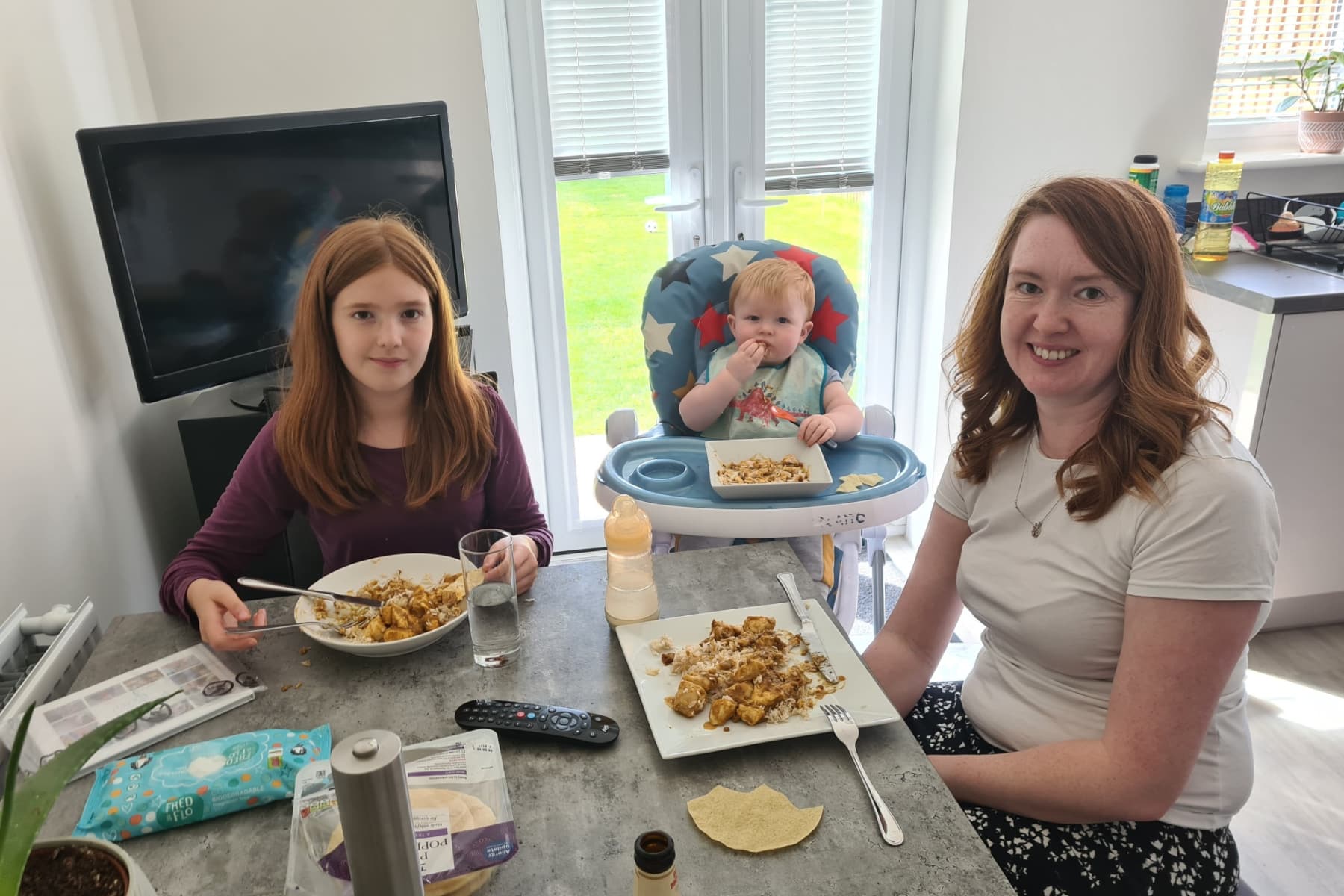 Laura, George and Rosie eating at the table