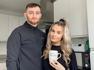 Couple in kitchen of new home