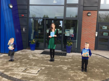 Lady with two children outside building