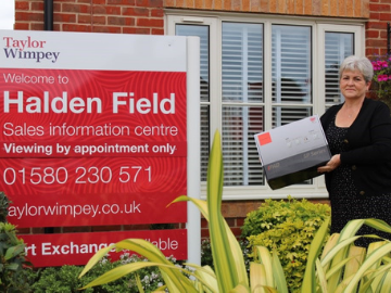 Lady outside Halden Field Sales Information Centre