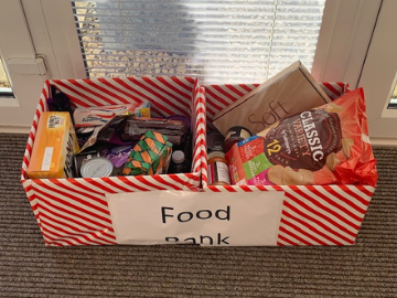 Two striped boxes with groceries inside