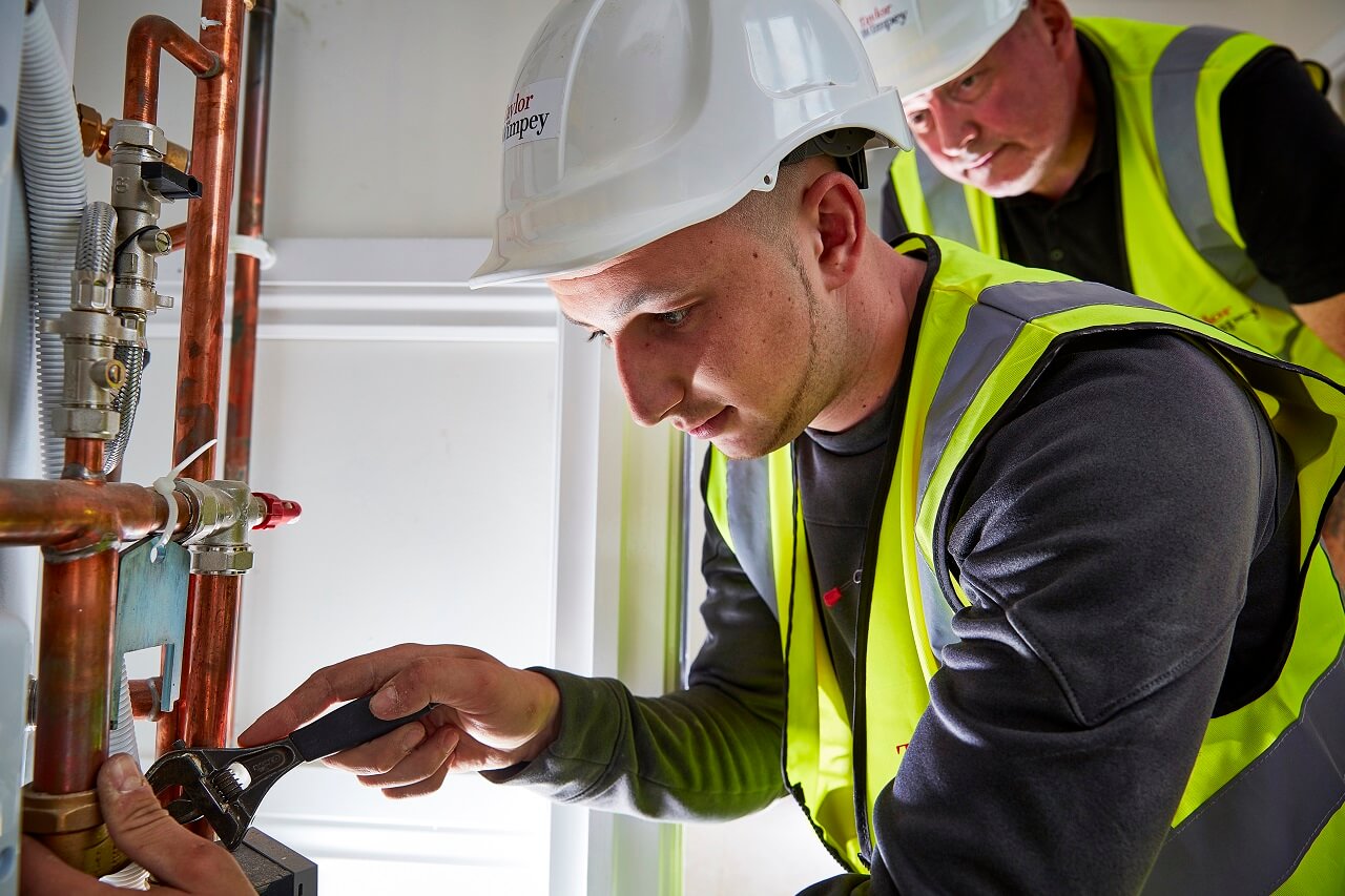 Staff working on pipes