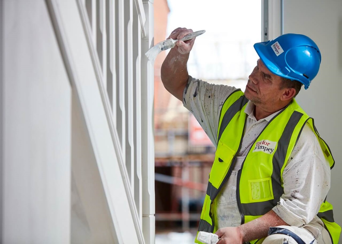 Man painting staircase