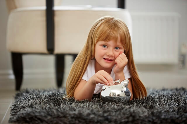 Child with piggy bang