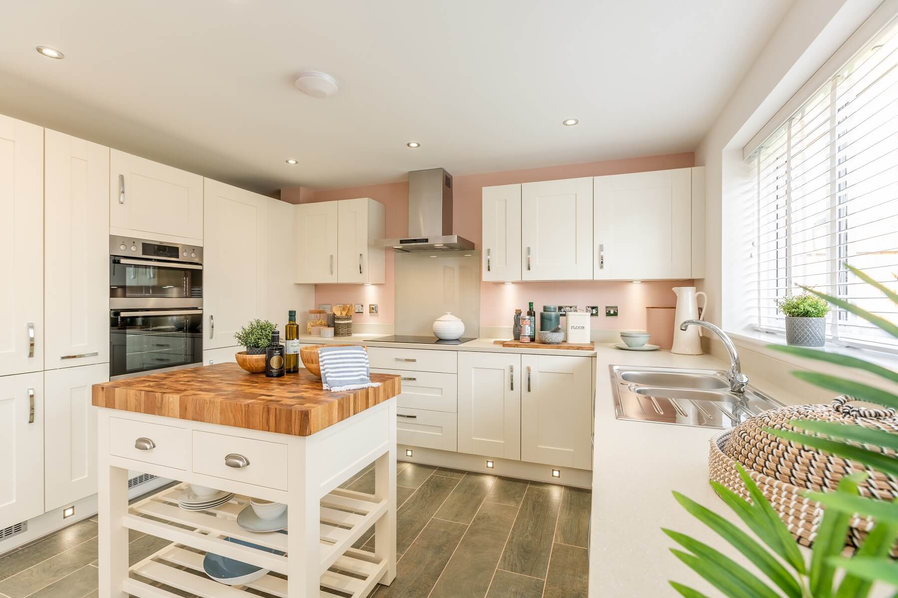 White kitchen with wooden worktops
