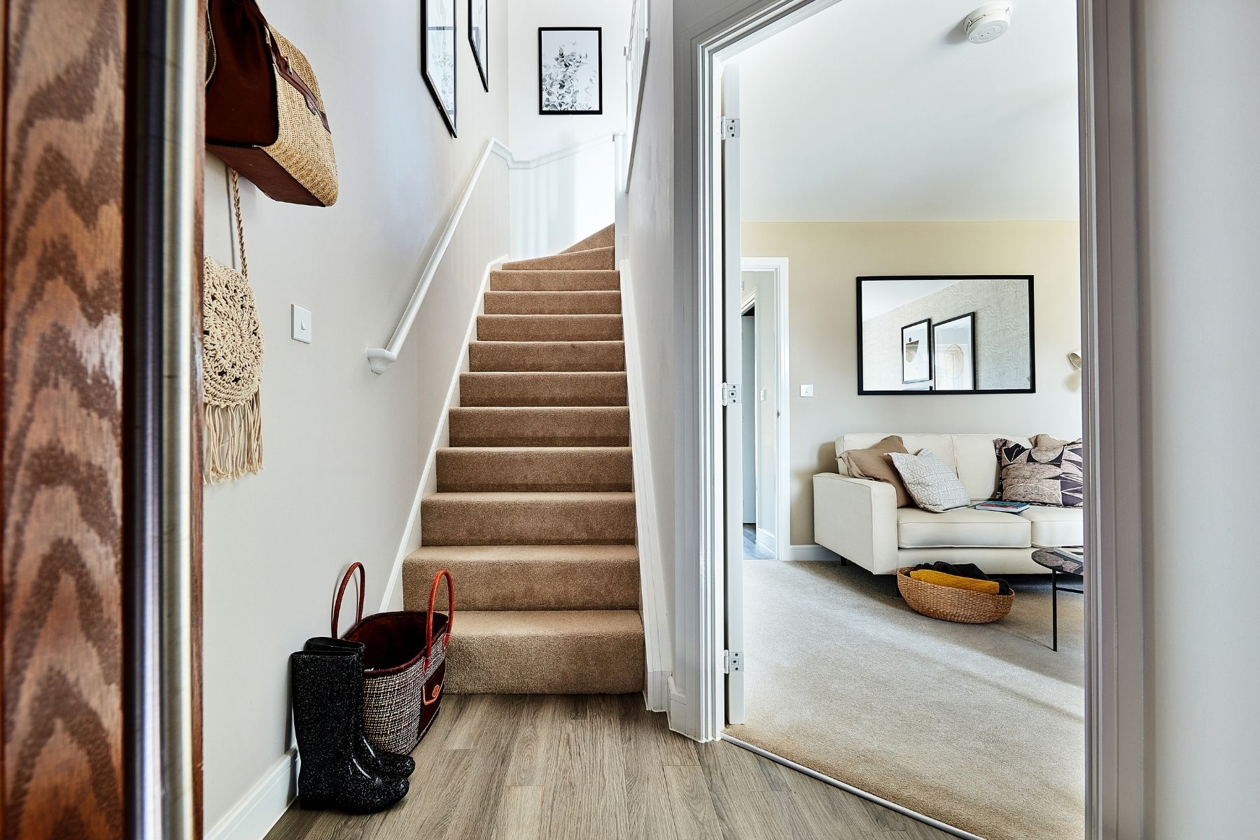Hallway and stairs with view into living room