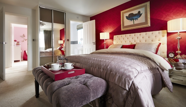 Red bedroom with foot rest