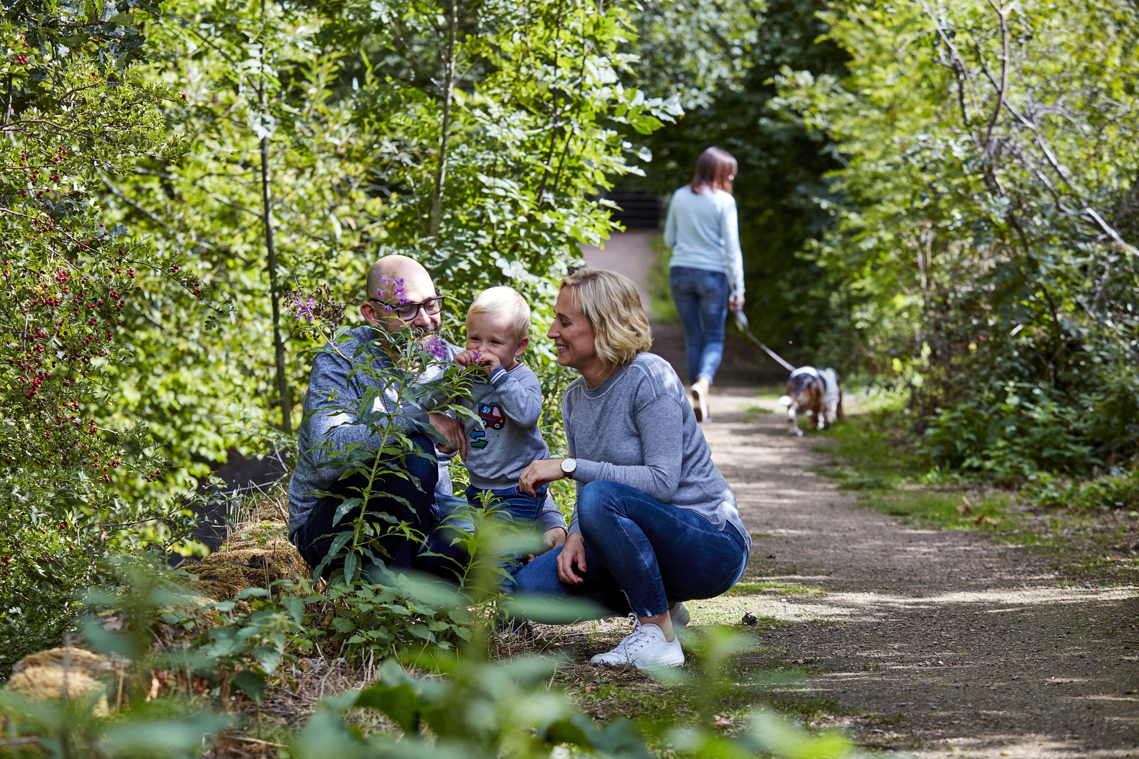 People looking at plants in local park