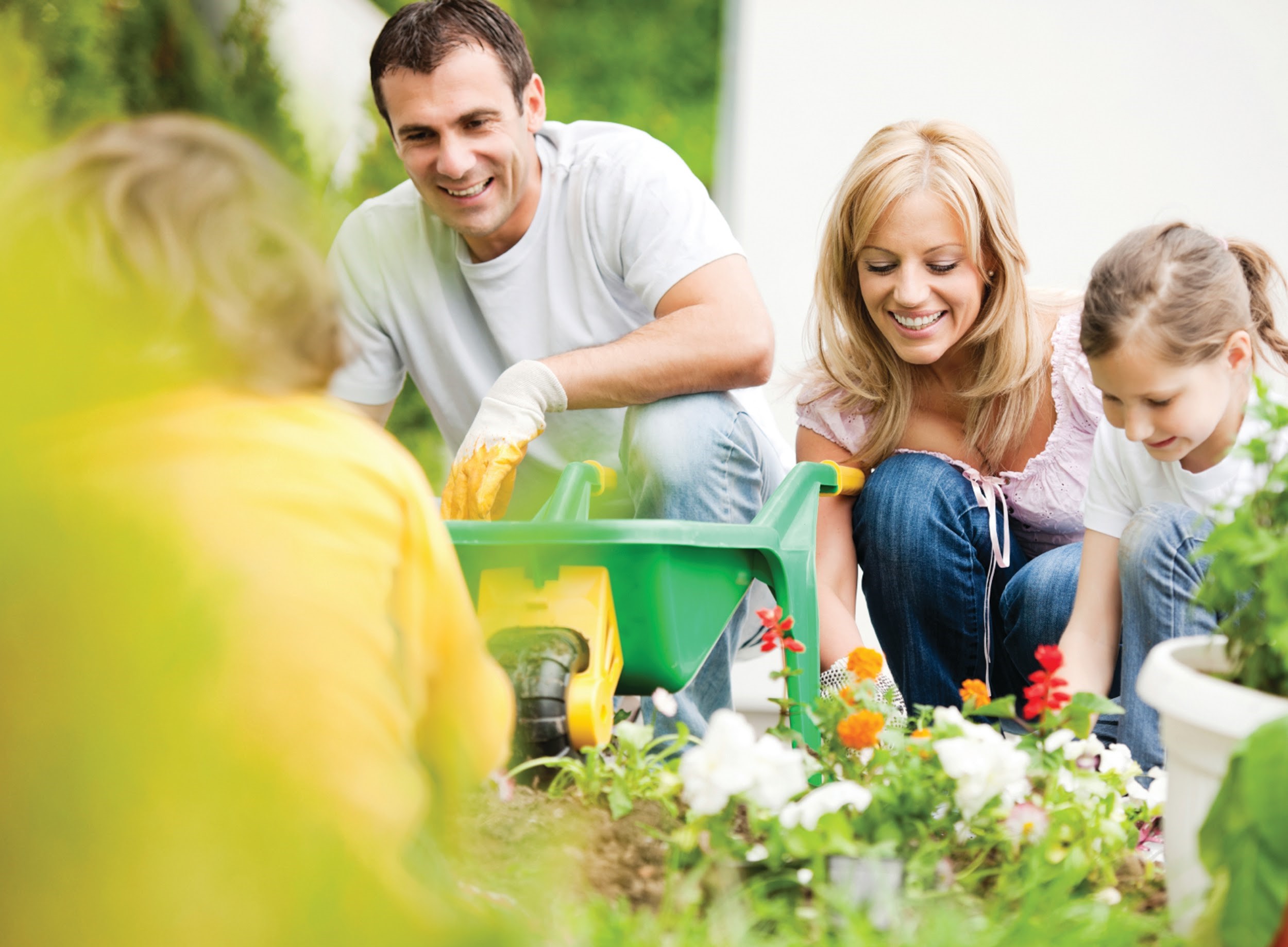 Family of 4 doing some gardening