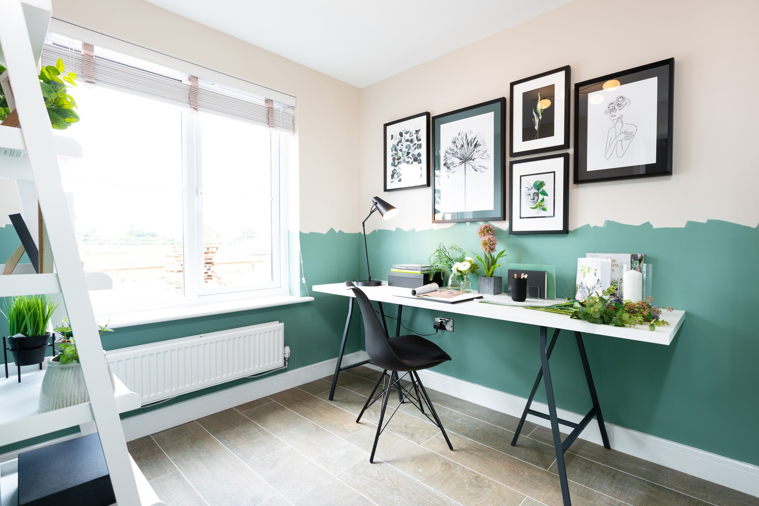 Room with desk with split coloured walls