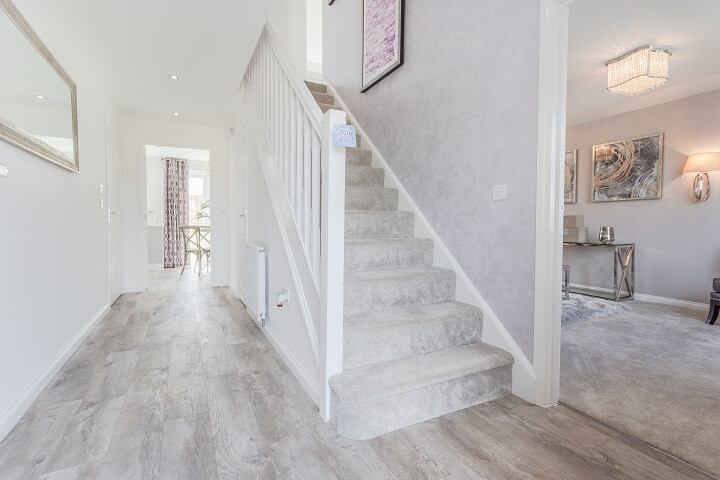 Grey hallway leading into living room