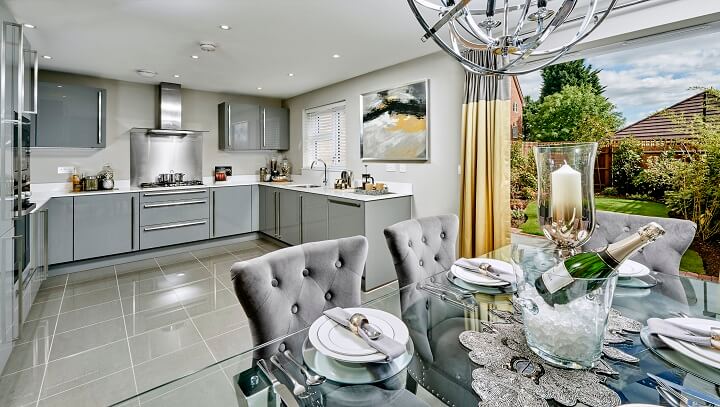 Grey kitchen with doors open to garden