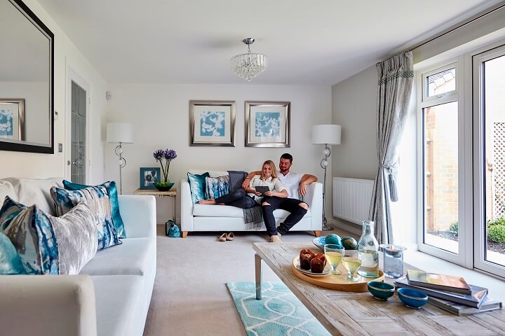 Grey living room with couple on sofa