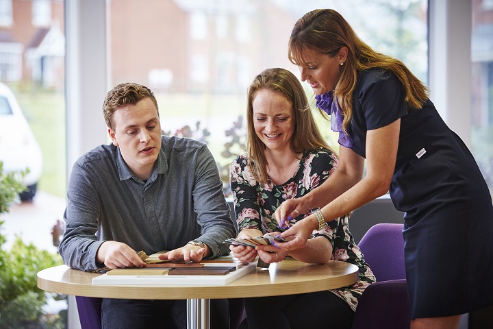 Customers and sales executive choosing flooring