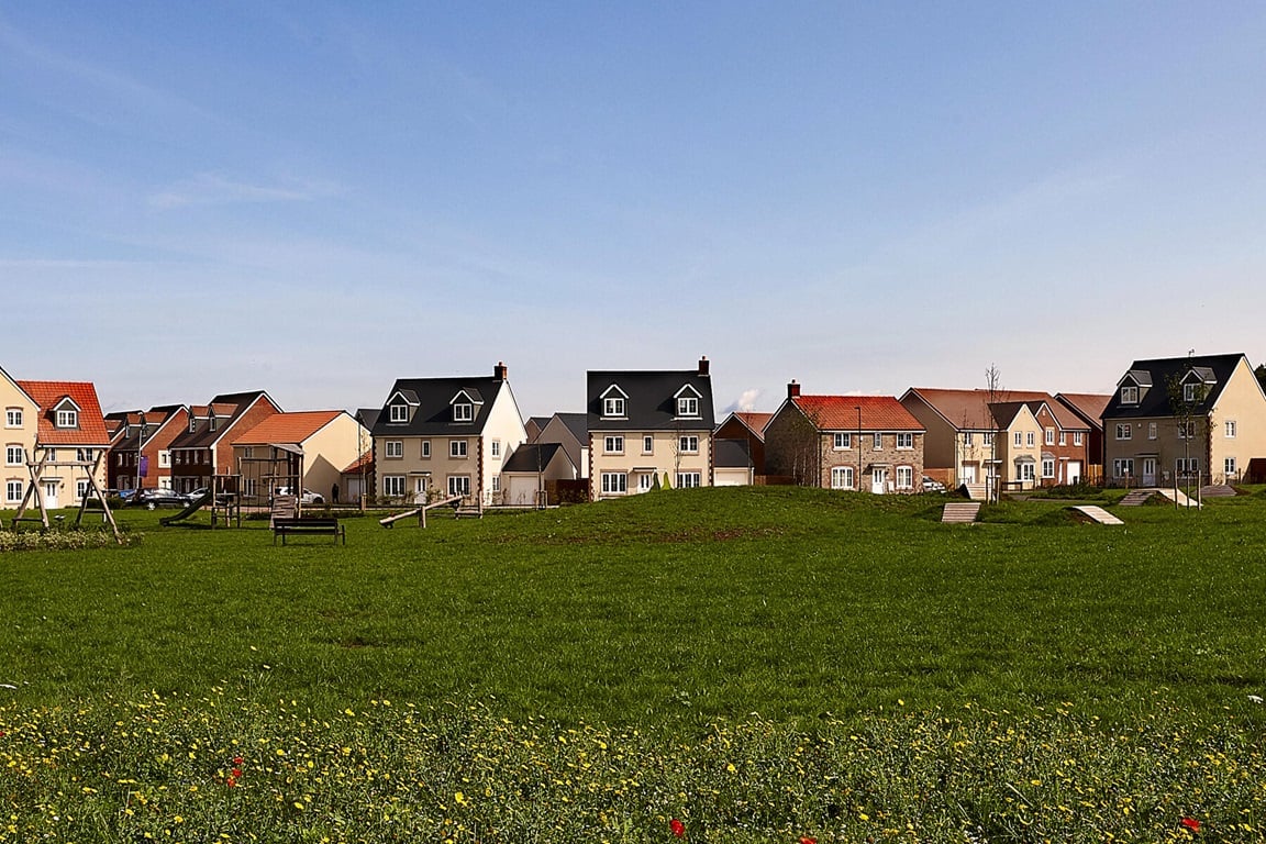 Edge of development street scene with grass in foreground