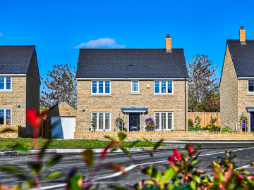 Exterior of new home built using light coloured stone
