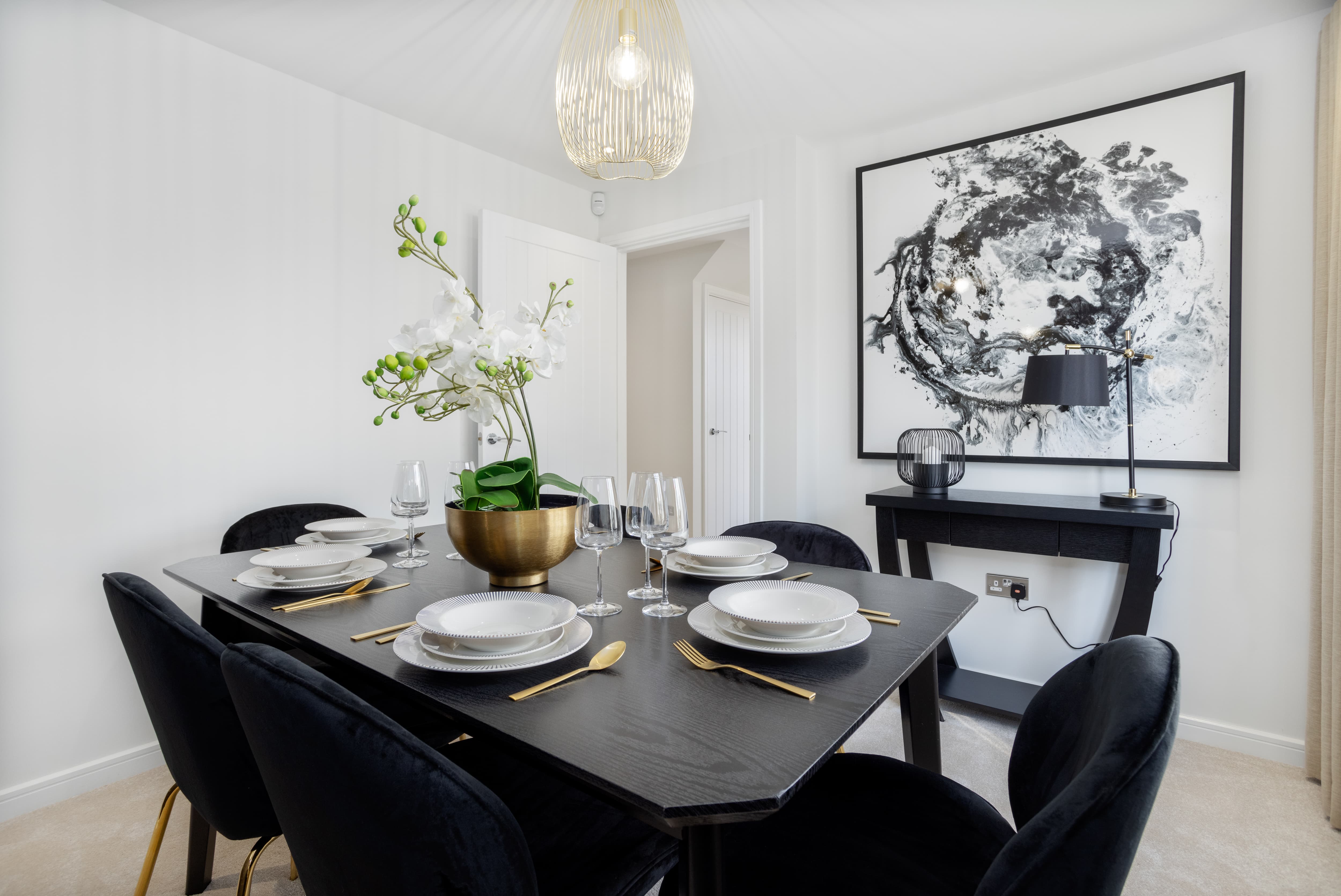 Dining table in white walled room