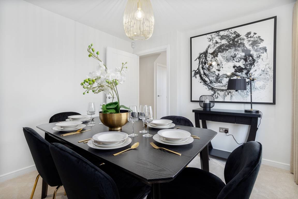 Dining table in white walled room