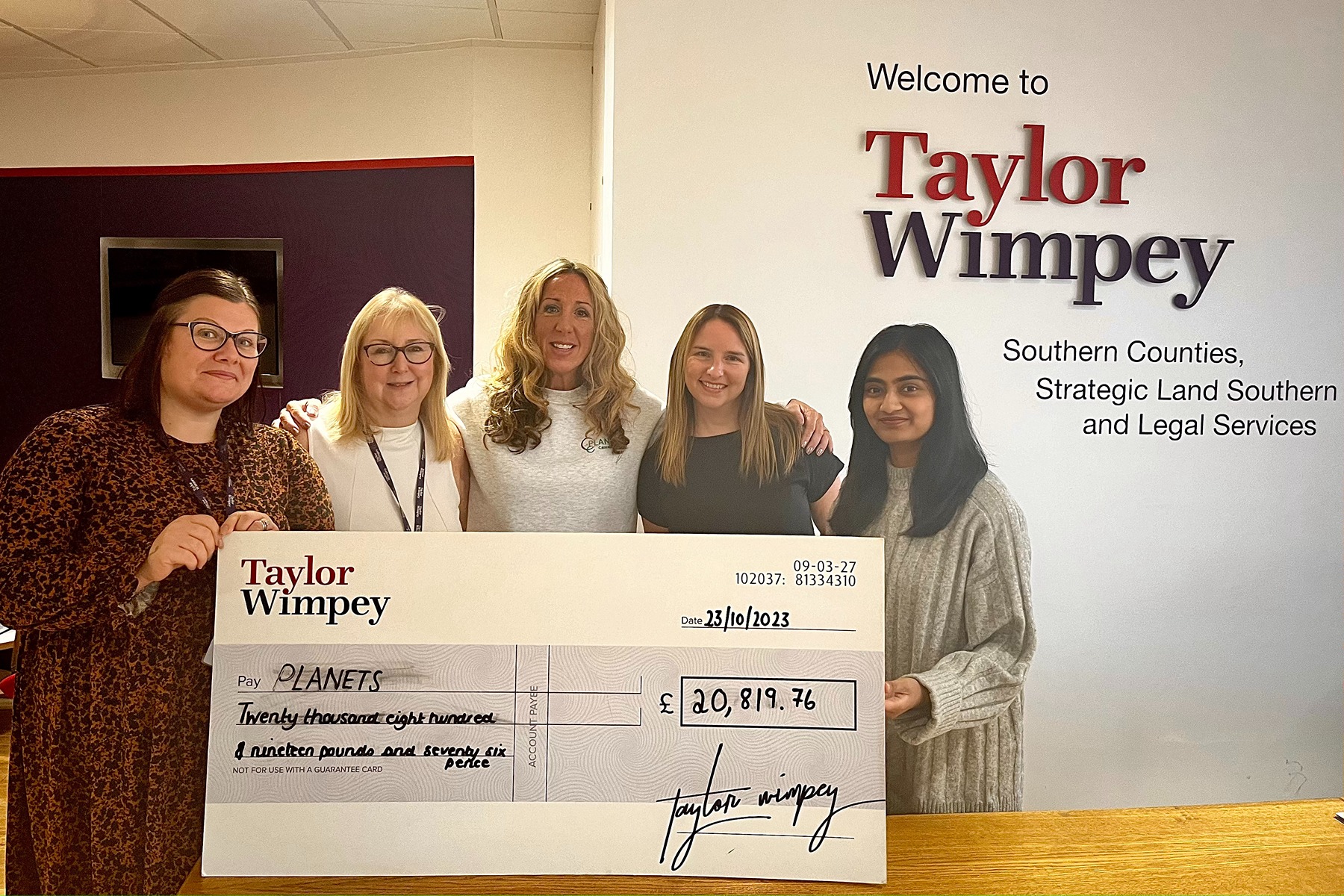 PLANETS charity fundraising cheque