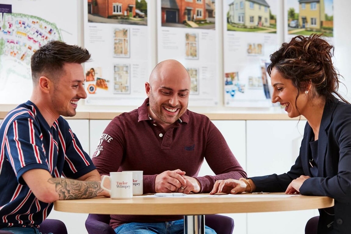 Couple discussing with Sales Executive