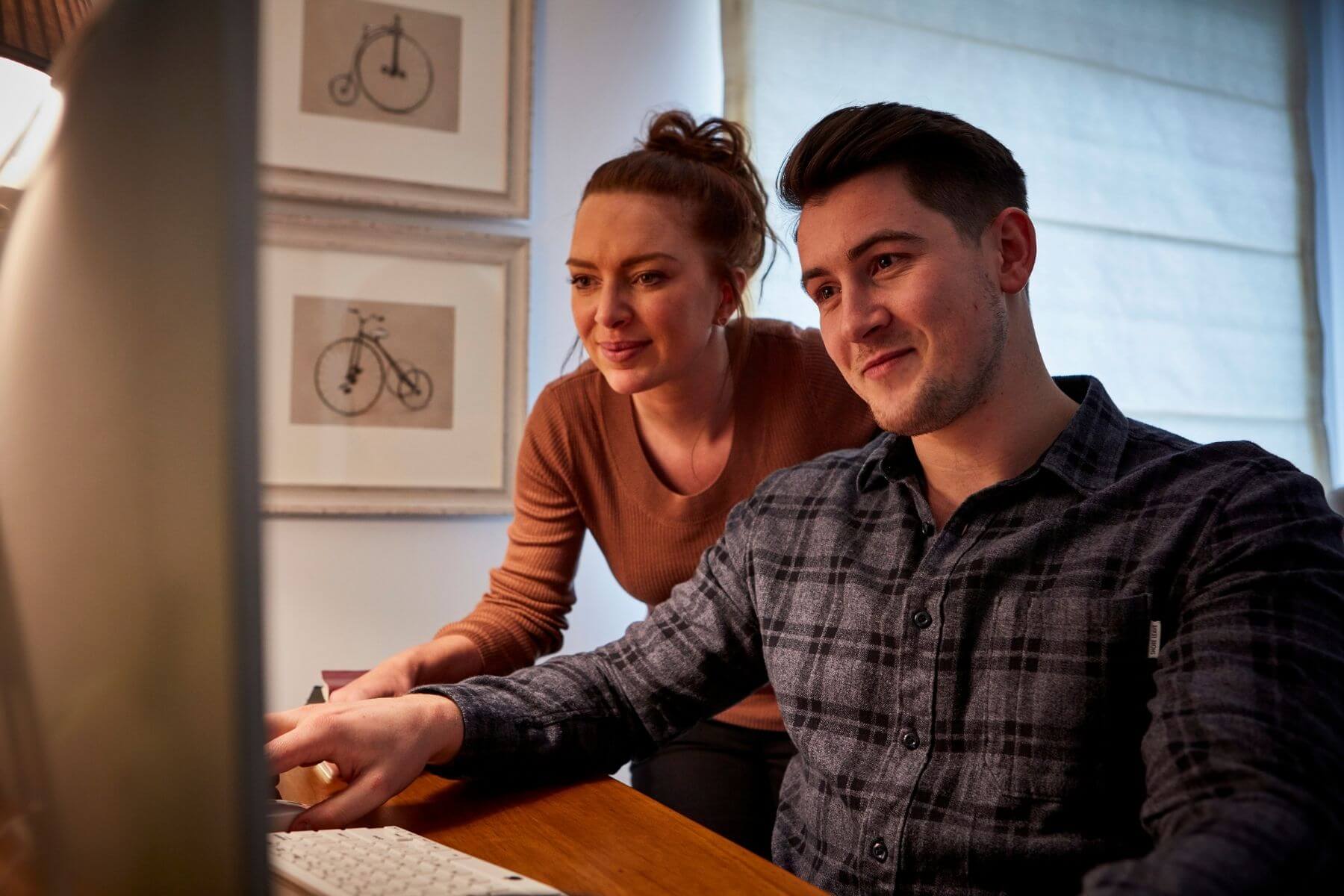 Couple looking at computer