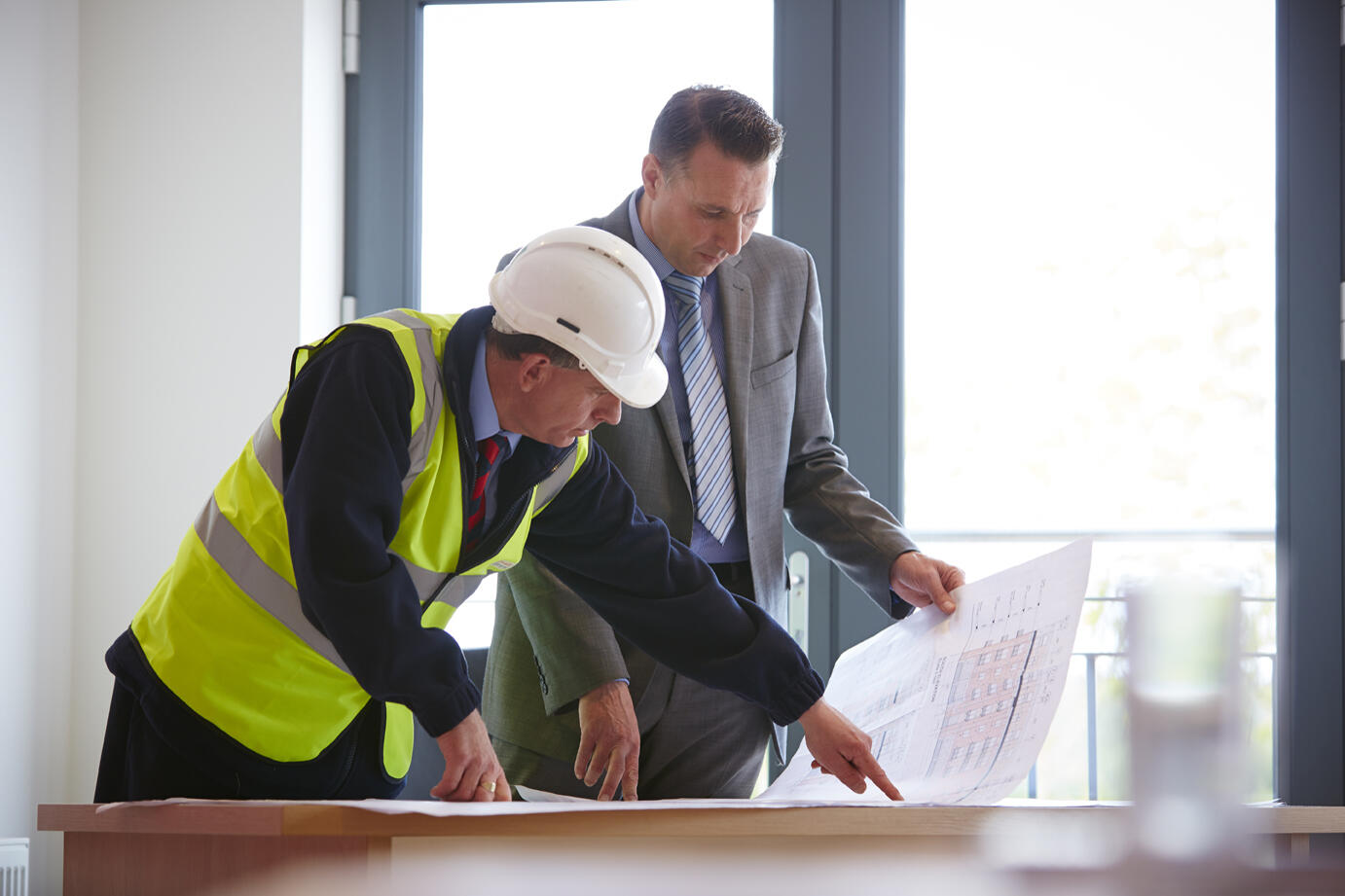 Men looking at plans