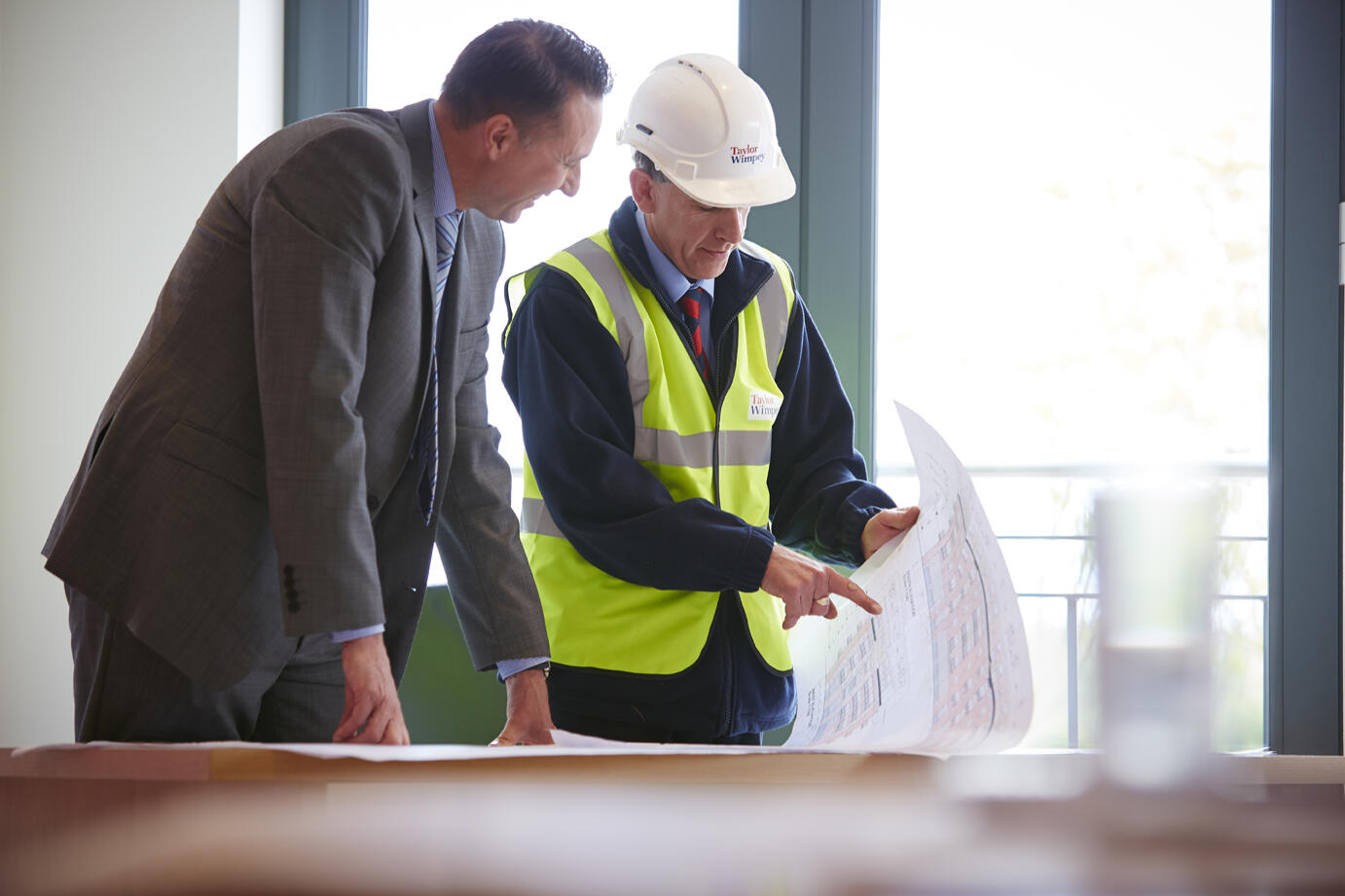 Men looking at plans