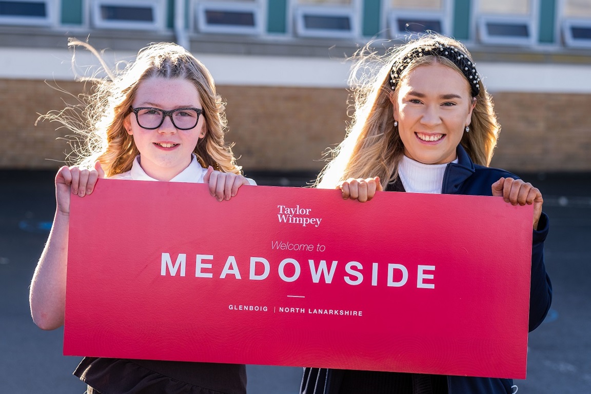 The winner of Taylor Wimpey's development naming competition in Glenboig with representative from Taylor Wimpey West Scotland