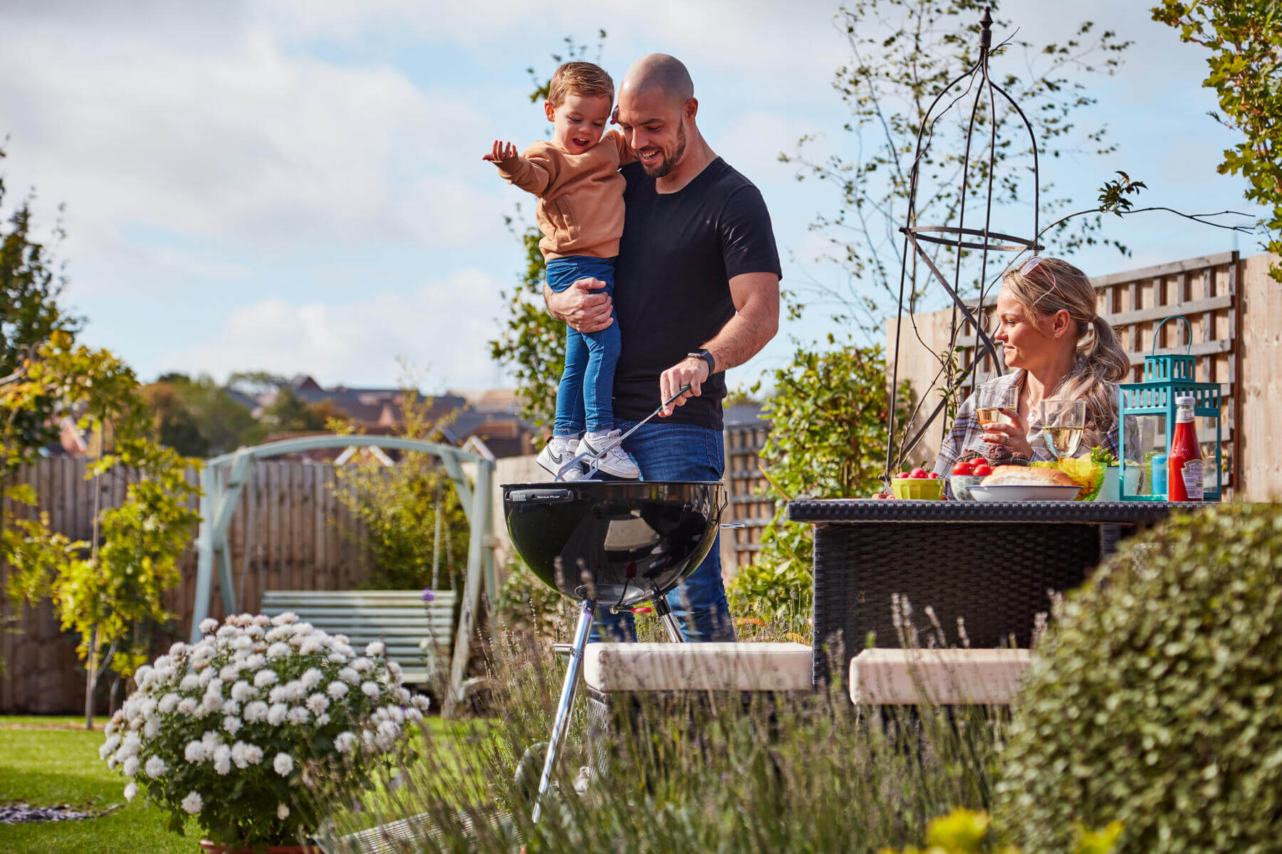 Family in a garden with BBQ