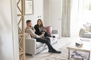 Couple sitting on sofa