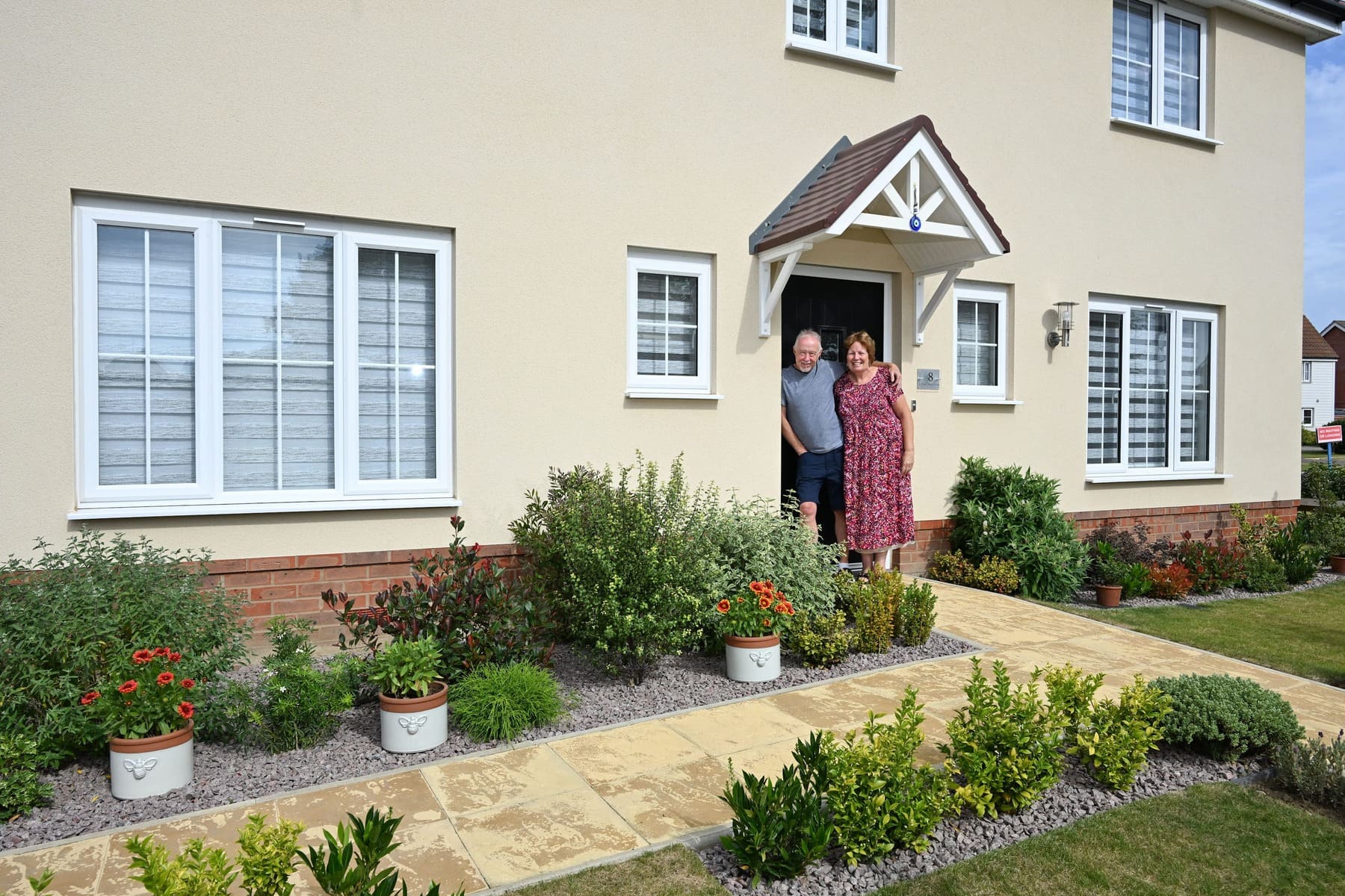 Man and woman outside front door