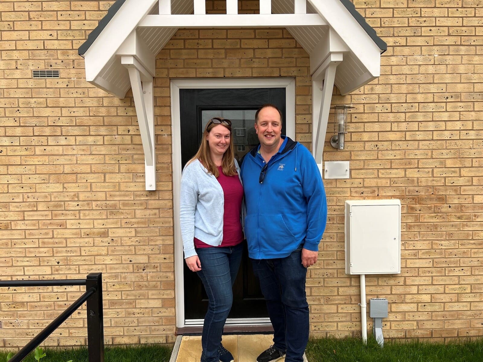 Happy customers outside home