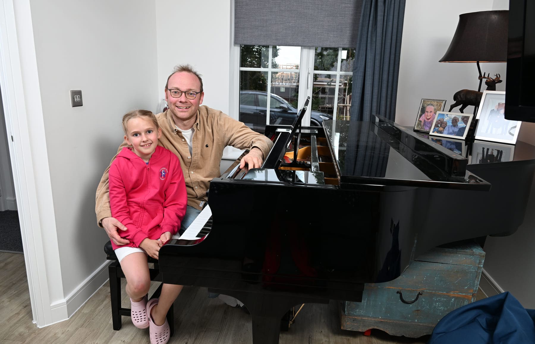 Dad and daughter at piano