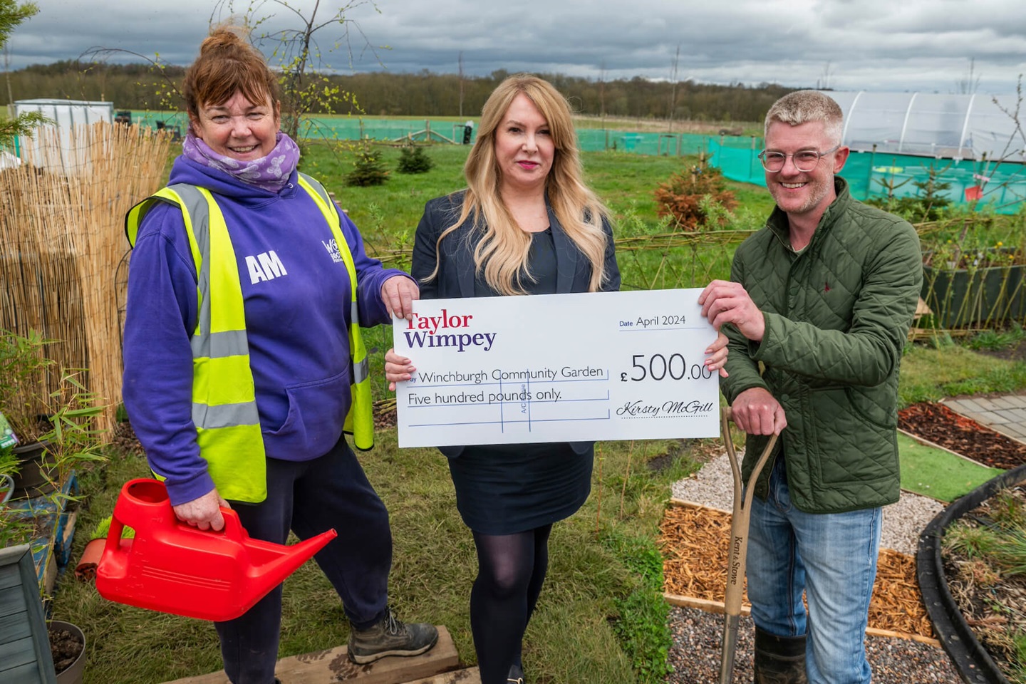 Winchburgh Community Growing Group volunteer – and Head Winchburgh Womble, Aileen Murdoch) and John West (Chairman & co-founder) - with local Taylor Wimpey sales executive Isla Lucey.