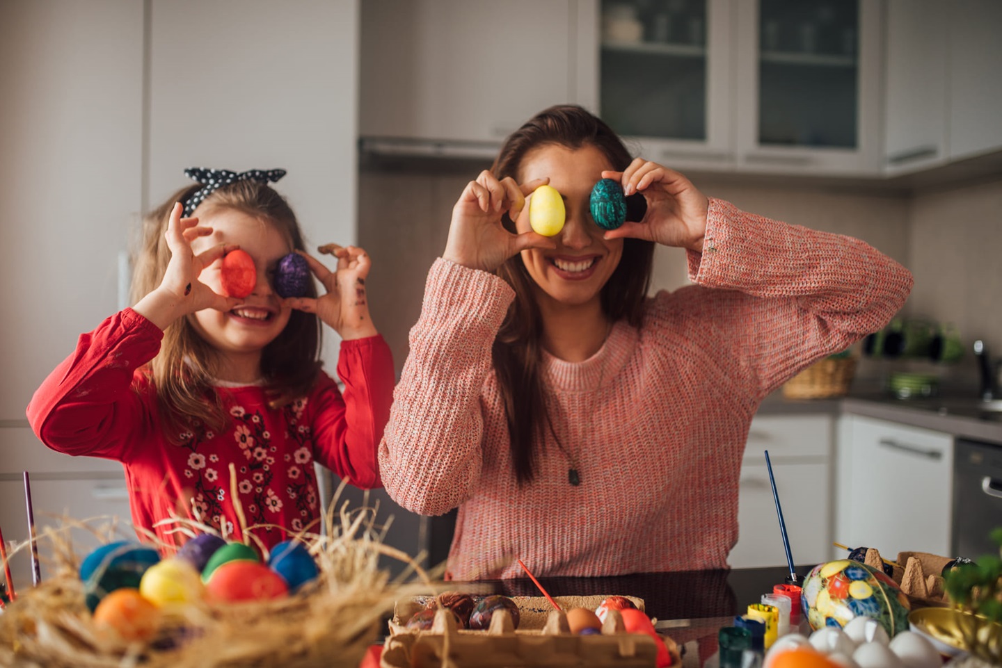 Adult and child with Easter Eggs