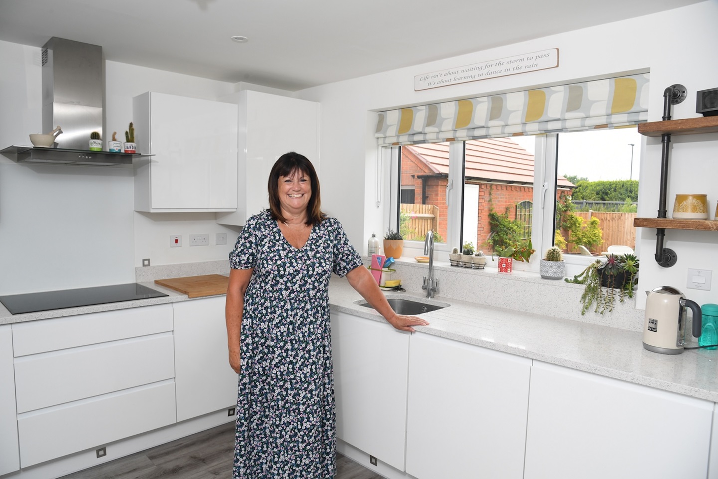 Tracey McNaught a resident at Boundary Moor Gardens poses in her kitchen