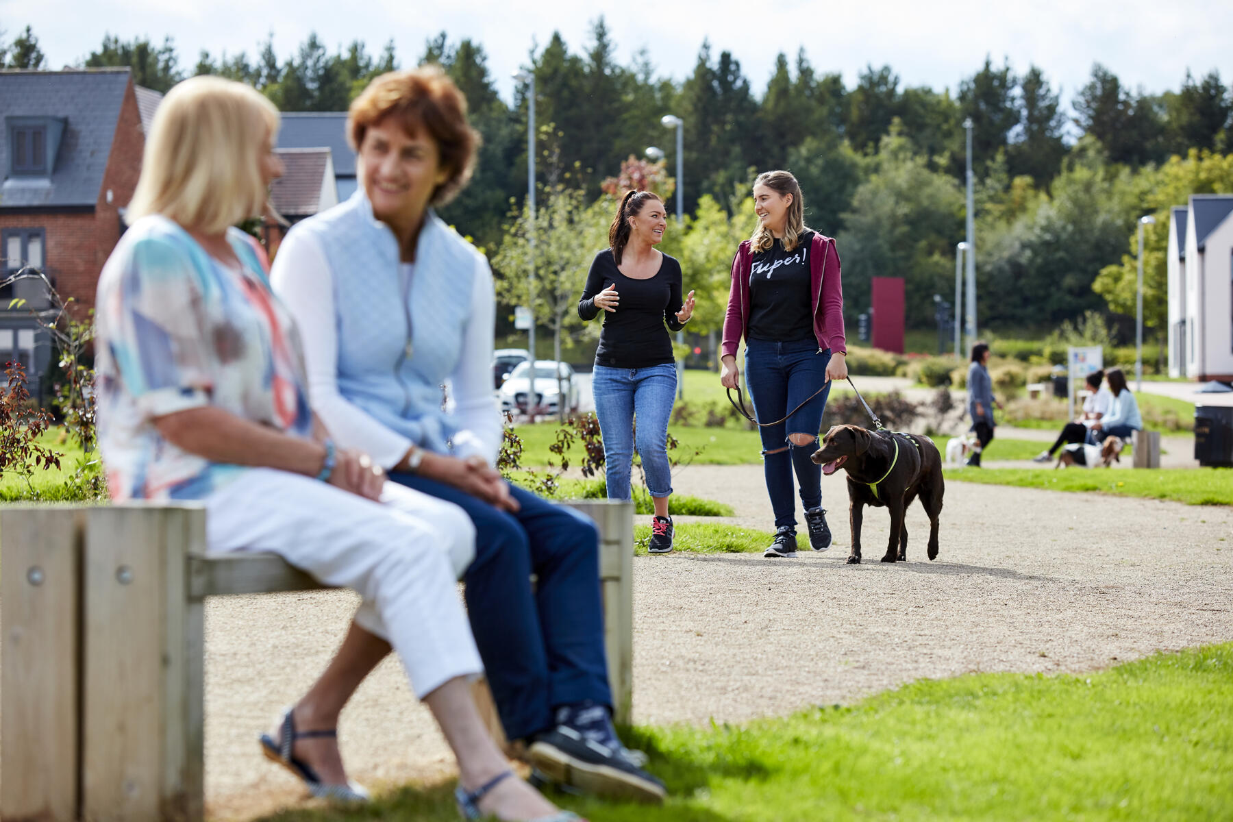 people sitting on a bench chatting bring the community together