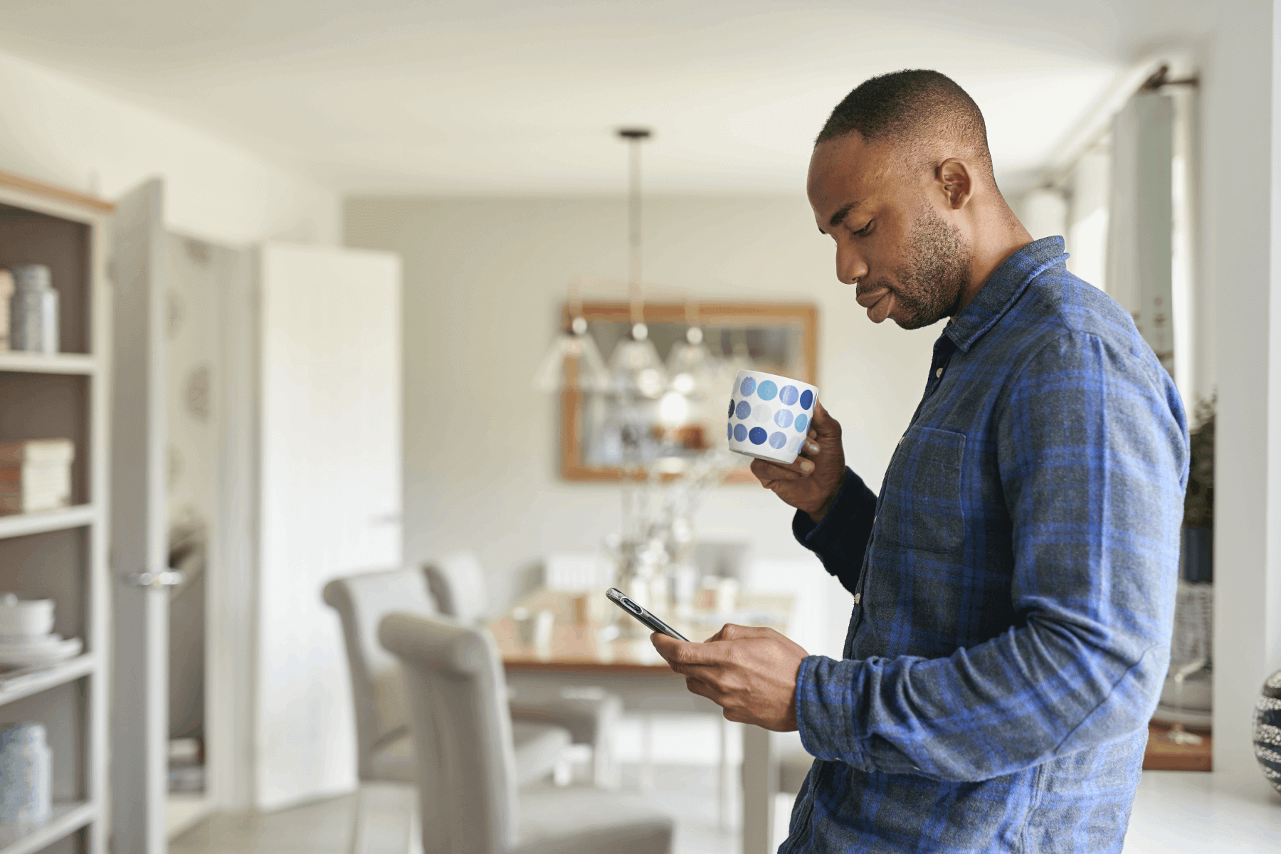 Man standing using his mobile